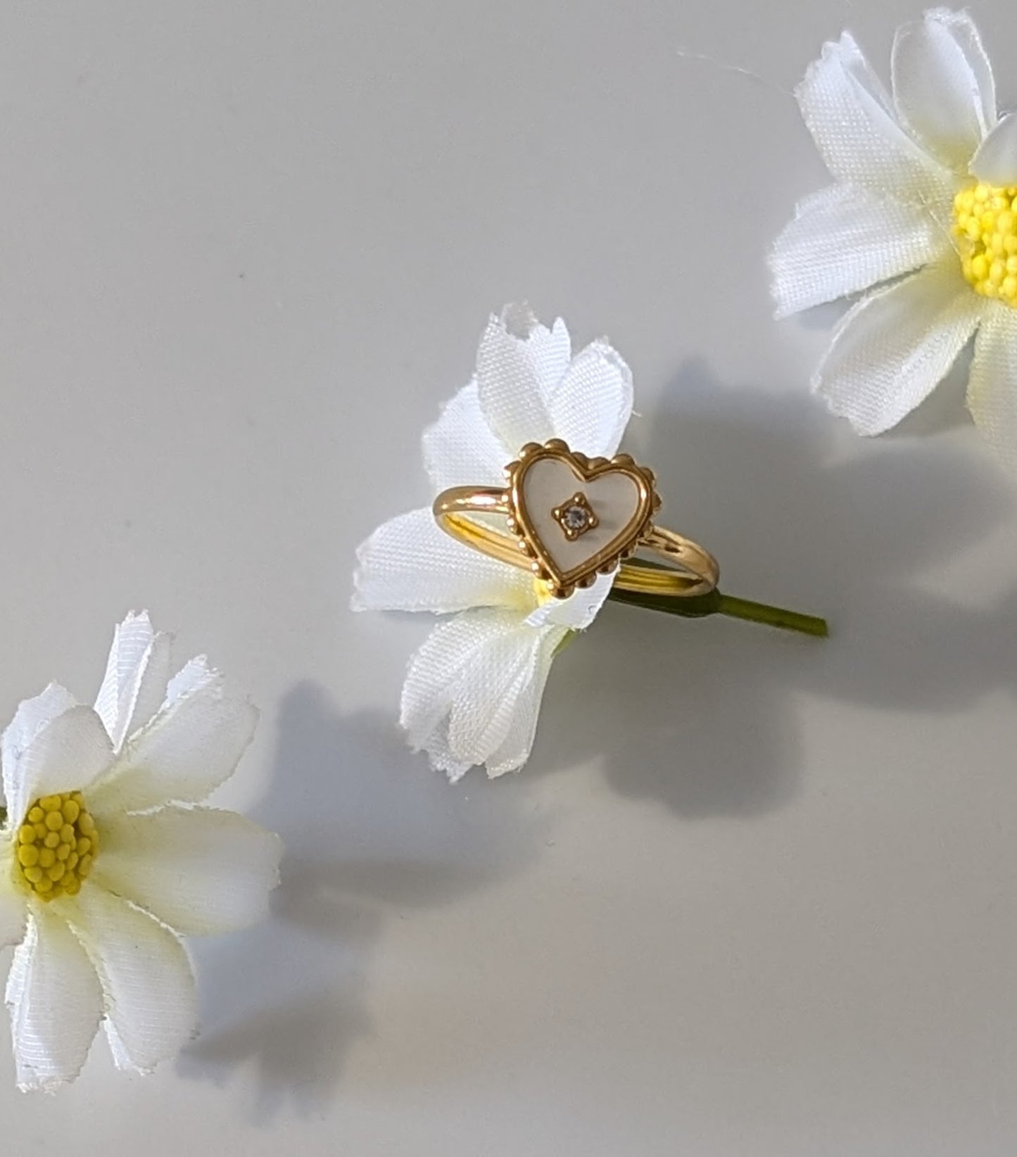Heart-shaped ring with white opal